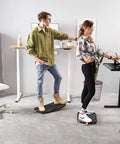 People using Standing Desk Mat With Anti Fatigue Bar And Wooden Wobble Balance Board For Ergonomic Comfort And Active Office Or Home Use All Day Medium Size Obsidian Black
