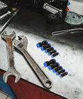Get The Ultimate Air Hose Fittings Kit With 50 Pieces Of Quick Connect Pneumatic Push to Connect Adapters In Copper And Abs For Air Compressors In 4mm To 12mm Sizes That Are Built Tough For Auto Work And Heavy Duty Jobs All Season Long on a workbench