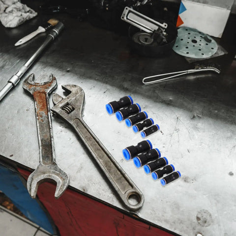 Get The Ultimate Air Hose Fittings Kit With 50 Pieces Of Quick Connect Pneumatic Push to Connect Adapters In Copper And Abs For Air Compressors In 4mm To 12mm Sizes That Are Built Tough For Auto Work And Heavy Duty Jobs All Season Long on a workbench