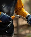 Person holding GomBoy Curve Professional Folding Saw 240mm With Impulse Hardened Teeth, Large Curved Blade For Pruning And Woodworking