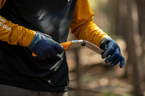 Person holding GomBoy Curve Professional Folding Saw 240mm With Impulse Hardened Teeth, Large Curved Blade For Pruning And Woodworking