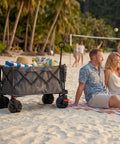 Heavy Duty Collapsible Folding Wagon With Brakes And Cup Holders All Terrain Wheels 500 Pound Load Utility Cart on beach