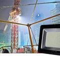 Led Flood Light, Ip66 Waterproof Super Bright Security Lights, Outdoor, in use at a construction site with modern buildings.
