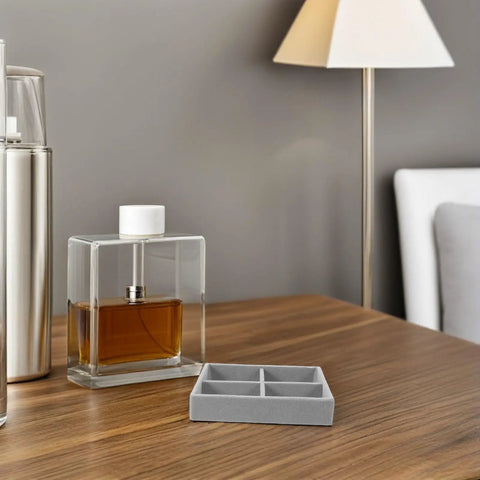 Slick Mini Velvet Jewelry Organizer Tray With Four Separate Dividers For Bracelets And Watches on a wooden table.