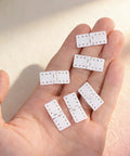 20 Pack RC Plane Hinges For Remote Control Aircraft Nylon Small Hinges in hand showing durable construction and flexibility.
