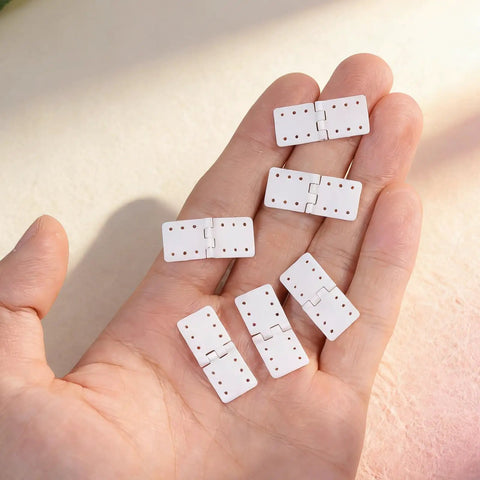 20 Pack RC Plane Hinges For Remote Control Aircraft Nylon Small Hinges in hand showing durable construction and flexibility.