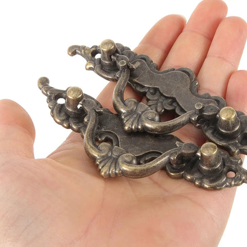 Hand holding Vintage French Provincial Style Cabinet Pulls 2 Pack Antique Metal Drawer Handles for dresser and cabinets