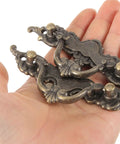 Vintage Style Cabinet Pulls 2 Pack Antique Bronze Drawer Handles held in hand showing ornate design details.