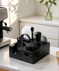 Game Changer 51 Mm Espresso Accessory Bundle serving as an on the fly barista station with various black tools and espresso cup.