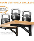 Storystore folding shelf brackets installed under a wooden shelf; black metal, 12in, collapsible pair (150 lb)