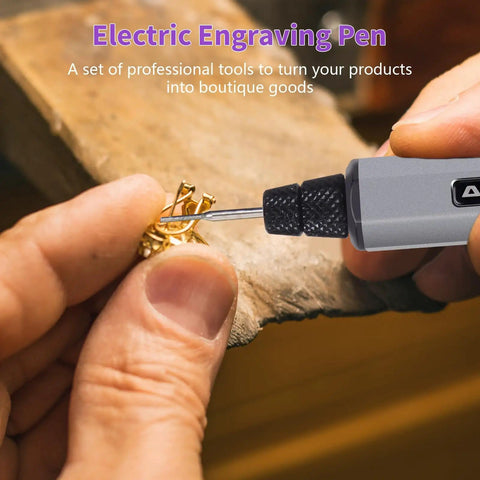 Mini Engraving Pen Cordless Portable Tool for Artists and DIYers with 30,000 RPM in use on metal jewelry piece