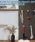 Magnetic Hooks For Cruise Cabins 130 Lbs Heavy Duty Neodymium Magnets holding tools on a wall, showcasing vertical strength.