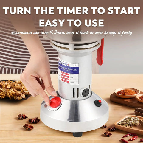 Close-up of Powerhouse 2500W Electric Grain And Spice Grinder Mill with timer and spices on table