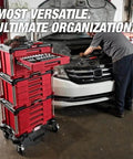 242 Piece Ratchet Socket Set With Four Drawer Rolling Tool Chest next to a technician working on a car engine.