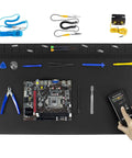 Extra Large Anti Static Soldering Mat With Grounding Accessories And Wrist Strap, organized with tools and electronics components
