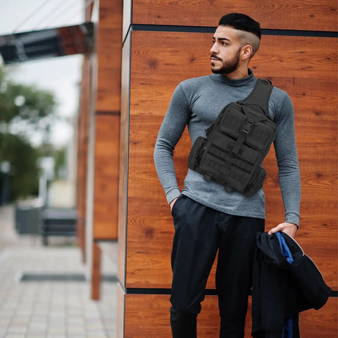 Man wearing Rugged Tactical Molle Sling Bag with Single Strap For Men EDC Everyday Carry Pack for outdoor activities.