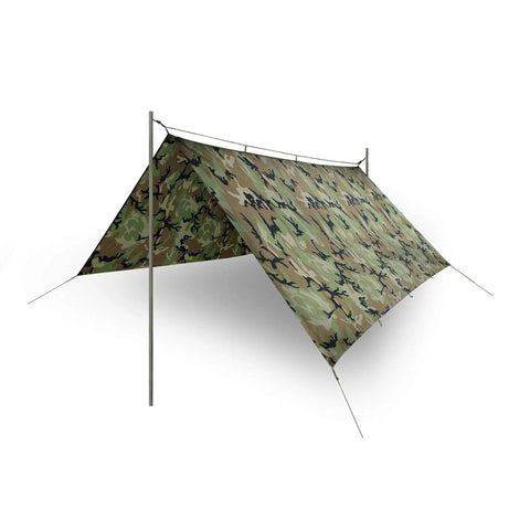 Supertarp Tarp Shelter In Pencott Wildwood Camo shown in A-frame setup, featuring reinforced attachment points and ripstop material.