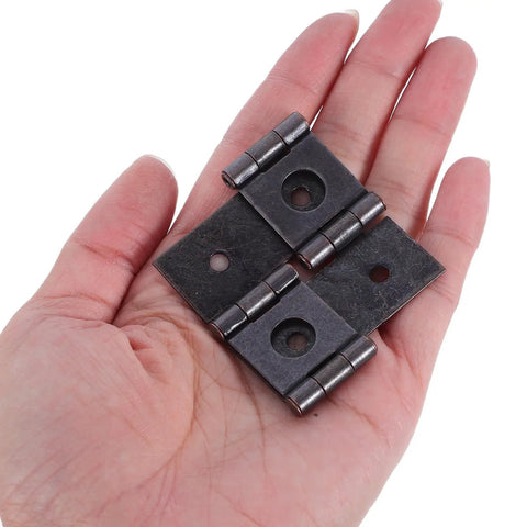 Vintage Bronze Gate Hinges Set, 10 Pcs, shown on hand, 54x47mm, for wood doors, kitchen cabinets, windows, provides smooth operation.