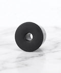 Black Rubber Floor Mount Door Stopper Set With Whisper Quiet Operation And Scratch Resistant Finish on white background