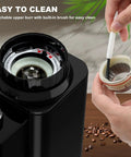 binROC Electric Conical Burr Coffee Grinder With Portafilter Holder In Sleek Black, showing detachable upper burr for cleaning.