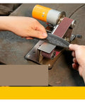 Compact Mini Belt Sander Machine For DIY Knife Sharpening And Polishing, user sharpening knife on workspace.