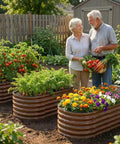Elderly couple harvesting veggies next to oval raised garden beds in backyard. Product: Three Piece Open Base Galvanized Metal Raised Garden Bed Kit.