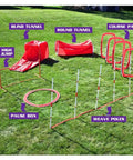 Red Six Piece Dog Agility Training Kit With Weave Poles, Tunnels, Adjustable Jump, Pause Box And Panels on grass setup