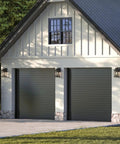 Outdoor One Light Wall Lantern From Williamston Collection In Antique Pewter Finish With Clear Glass For Wet Locations Classic Yet Modern Exterior Lighting installed next to garage doors on exterior wall.