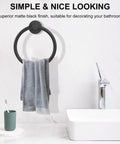 Matte Black Wall Towel Holder And Ring - Stainless Steel Heavy Duty Hand Towel Bar in a bathroom setting with towel hanging