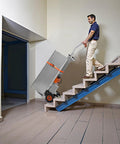 Person using VEVOR Electric Stair Climbing Dolly 440 Lb Capacity Heavy Duty Hand Truck on stairs with cargo.