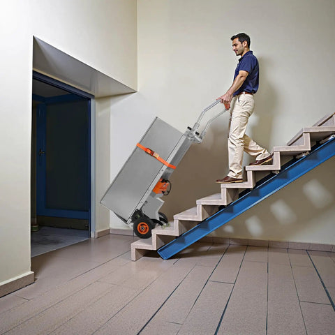 Person using VEVOR Electric Stair Climbing Dolly 440 Lb Capacity Heavy Duty Hand Truck on stairs with cargo.