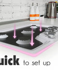 Illustration of Reusable Gas Range Protectors For LG Stoves, Nonstick And Washable Stove Liners, fitted on a gas range surface.