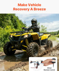 VEVOR 3500 Lb Electric Winch 12V DC For Boat Pickup Truck being used on a muddy ATV with wired remote control.