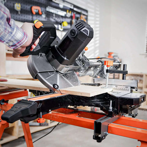 DOVAMAN 10-inch sliding miter saw, side view, cutting wood on an orange stand.