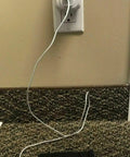 No Fuss Single Outlet Safety Timer With Push Button Countdown Automatic Shutoff Shields Home Electronics From Overcharging, plugged in with phone charger.