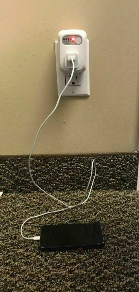 No Fuss Single Outlet Safety Timer With Push Button Countdown Automatic Shutoff Shields Home Electronics From Overcharging, plugged in with phone charger.
