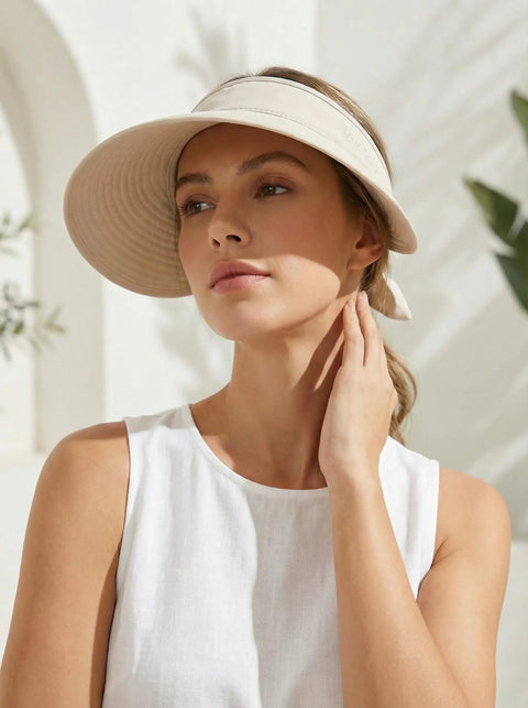 Woman wearing 2-In-1 Women's Sun Visor Hat With Wide Brim Or Zip-Off Top, lightweight quick-dry, ponytail friendly, UPF 50+.