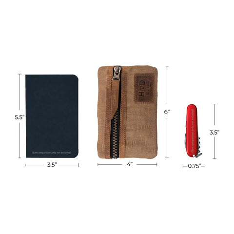 Slim Waxed Canvas EDC Pocket Pouch With Leather Accents next to notebook and Swiss army knife for size comparison