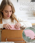 Woman placing No Sweat Portable Potty For Toddler Pink Travel Training Seat That Snaps Securely Onto Standard Toilets in a bag.