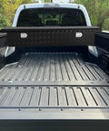 69 Inch Heavy Duty Crossover Aluminum Truck Toolbox With Rust Proof Secure Slam Latch Pickup Bed Storage Chest For Contractors built over a truck bed.