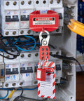 Electrical lockout with Lockout Tagout Kit 42 Piece Safety Set with padlocks, hasps, and tags in a breaker box.