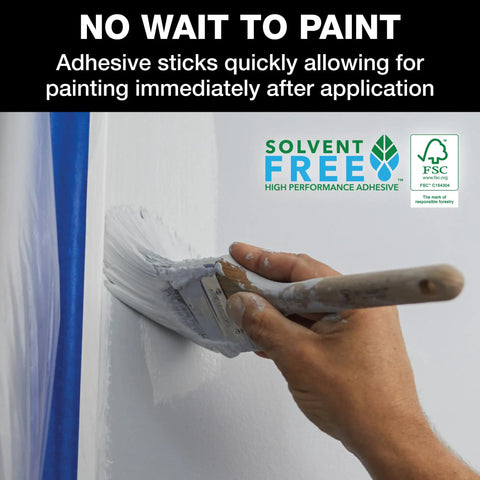 ProGrade Painter Tape With PaintBlock Technology Blue 1.5 Inch Wide Multi Surface Masking Tape Medium Adhesion 6 Rolls 1.41 In X 60 Yds for Walls and Trim shown being used on a wall with white paint and brush.
