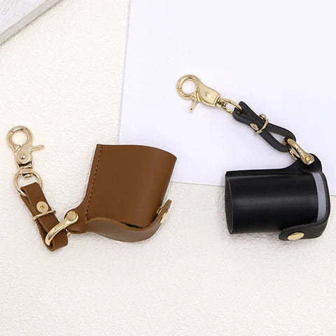 Brown and black Compact Water Film Holder Case With Keychain Clip And Quick View Waterproof Film Storage Bag shown on white background.