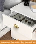 Champagne bronze bin cup cabinet pull on a white drawer, showcasing 5 Pack Champagne Bronze Cabinet Pulls 3 Inch Hole Centers.