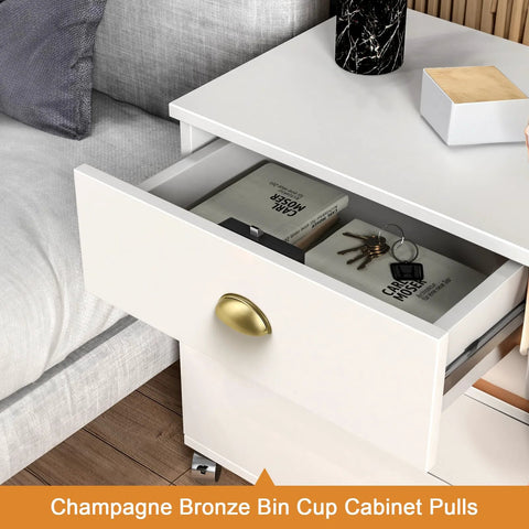 Champagne bronze bin cup cabinet pull on a white drawer, showcasing 5 Pack Champagne Bronze Cabinet Pulls 3 Inch Hole Centers.