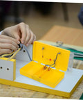 Reliable Conductivity Learning Kit for Hands On Physics Experiments in use with yellow circuit board in a classroom setting