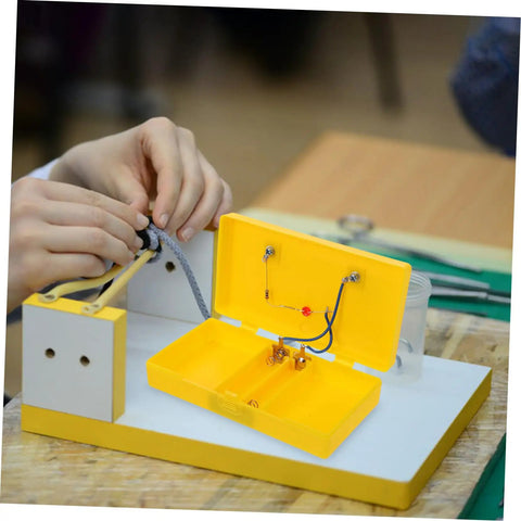 Reliable Conductivity Learning Kit for Hands On Physics Experiments in use with yellow circuit board in a classroom setting