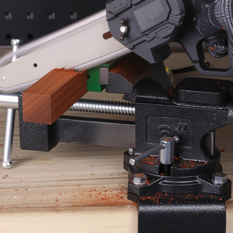 Image of Industrial Grade Rock Solid Heavy Duty 6 Inch Bench Vise With All Steel Swivel Base And Dual Jaw Design holding wooden block.