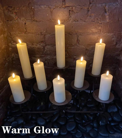 Flameless Votive Pillar Candles Set Of 7 With Remote, Ivory LED Candles With Timer And Batteries Included, arranged on holders