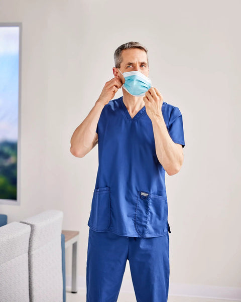 Person wearing Four Layer Level 3 Medical Procedure Mask With Anti Fog Foam Ear Loops Blue Latex Free Ultra Breathable Comfort